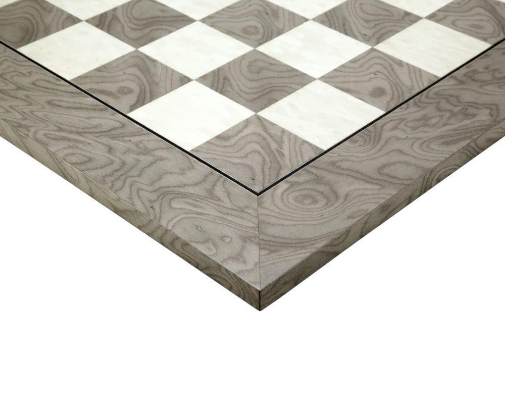 Close-up of a 21.7 inch high gloss lacquered grey ash burl and maple chess board with 2.17 inch playing squares.